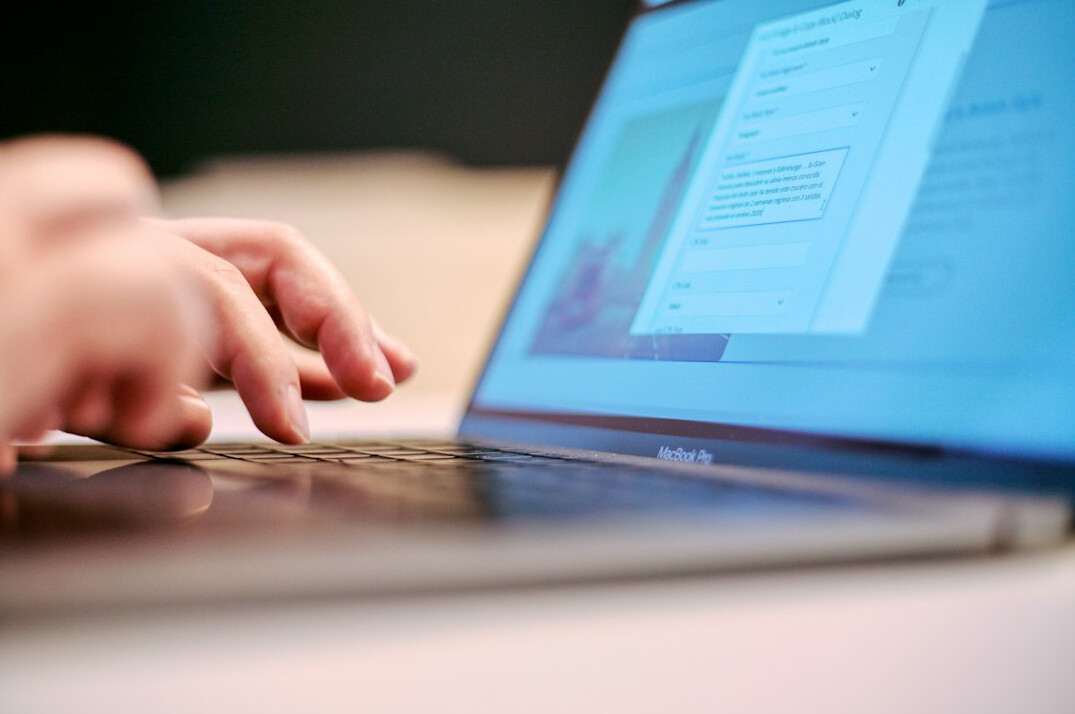 person verifying information on laptop